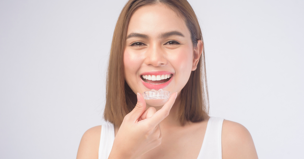 Smiling Invisalign patient after clear aligner treatment at Sikora Dental Chicago